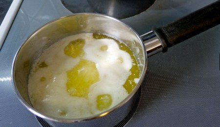 as butter melts, bubbles form and milk solids start to come to the top of the mixture
