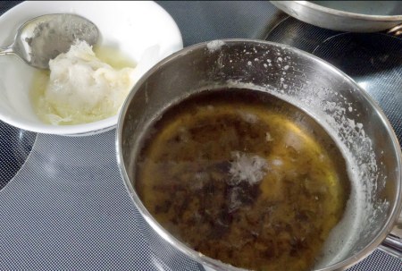 solids scrapped off and smaller bubbles starting to appear in the ghee