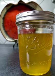 a small mason jar of ghee with a lid on